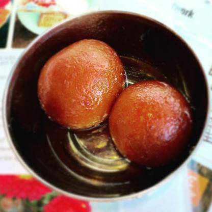 Gulab Jamun - Dessert! · Traditional Indian dessert. Donuts in sweet rose syrup. (contains dairy) Served cold but recommend heating up. Two pieces, Vegetarian
