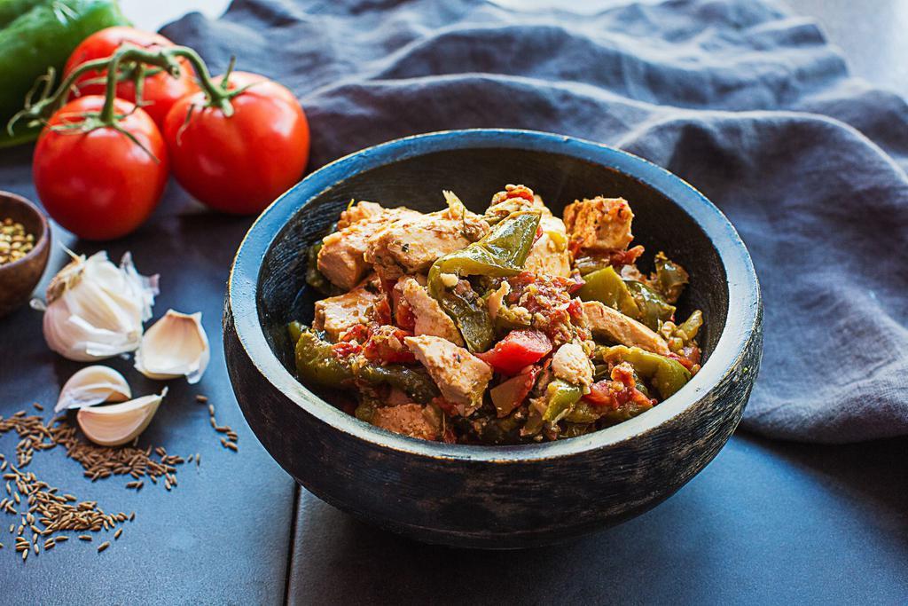 Karahi Paneer · Wok-tossed Indian cheese with green peppers and tomatoes. Vegetarian and gluten free.