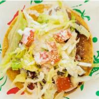 Tostada · With your choice of meat, sour cream, lettuce, tomatoes, cheese.