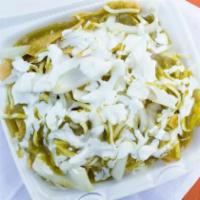 Chilaquiles · Crispy corn tortillas cooked in green tomatillo sauce, topped with chicken, sour cream, chee...