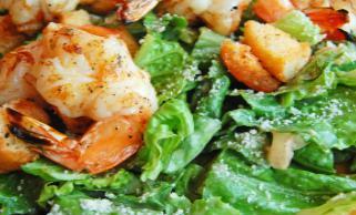 Shrimp Caesar Salad · iceberg lettuce, 5 jumpo shrimp, Parmesan cheese croutons with light Caesar dressing.