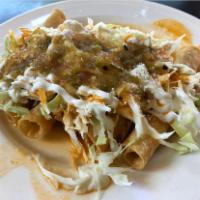 TAQUITOS PLATE · 6 CHICKEN TAQUITOS ROLLED IN A CORN TORTILLA WITH CABBAGE, SOUR CREAM, SALSA AND COTIJA CHEE...
