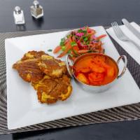 Camaron al Ajillo · Shrimp sauteed in garlic mojo sauce served with tostones and avocado salad. 