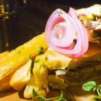 Pernil Sandwich · Roast pork, Swiss cheese, pickled onion and malta BBQ.