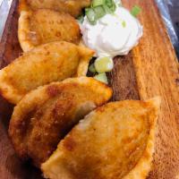 CRISPY FRIED PIEROGI · Variety of six deep fried dumplings, served w/ sour cream