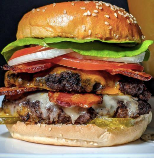 DOUBLE BACON CHEESEBURGER · Two beef patties, American cheese, bacon, lettuce, tomato, onions and pickles