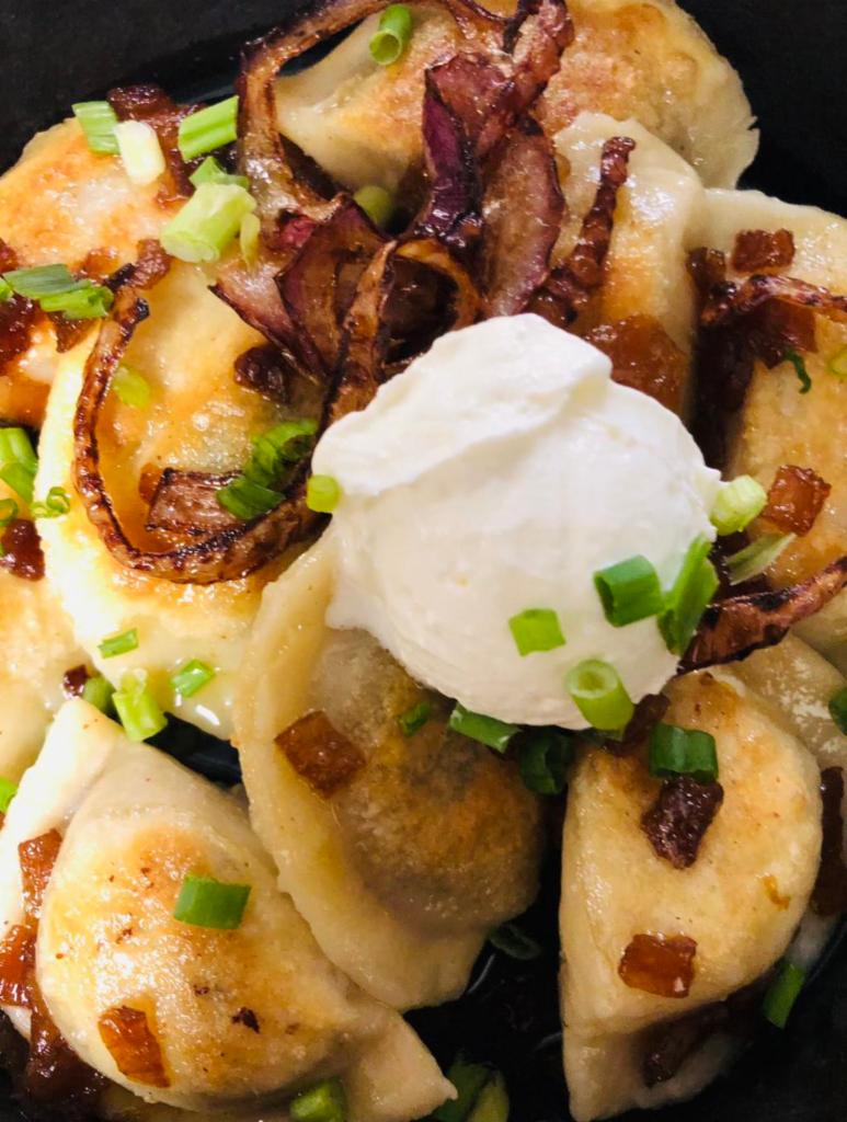 CHEF`S PIEROGI · Sauté potato & cheese pierogi, smothered with red smoked sausage, mushrooms & caramelized onions
