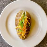 Baked Potato · Loaded up with cheddar cheese, sour
cream, chives & butter.