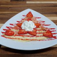 Strawberry Cheesecake Crepe · Cream Cheese, Strawberries, Coconut, Strawberry Syrup, Powdered Sugar (Whipped Cream not ser...