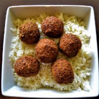 Falafel Rice Platter · 6 pieces of falafel served over rice with a side of tahini sauce, hummus, house salad and pi...