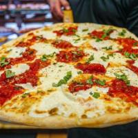 Margherita Pizza · Traditional neapolitan pizza with fresh mozzarella, garlic, plum tomato sauce and imported e...