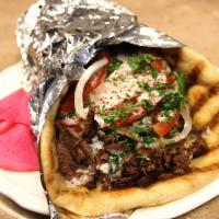 Beef Gyro Wrap · Grilled Beef Shawarma Wrapped With FLATBREAD. Served With Tomatoes, Lettuce, Onions, Pickles...