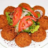 Falafel 8 Pieces  · Made of chickpeas and vegetables, served with pita bread and tahini sauce.