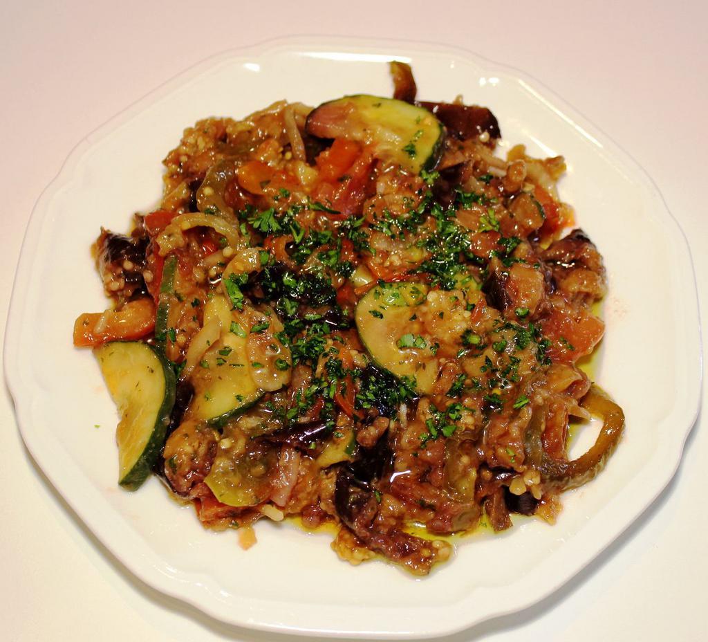 Eggplant Salad · Fried eggplant slices mixed with fresh green and red peppers and onions in summer special sauce.  Vegetarian.