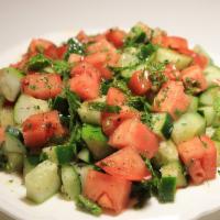Sumer Salad · Slices of cucumbers, tomatoes, mint, lemon juice and olive oil.  Vegetarian.