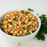 Chickpeas Salad · Chickpeas mixed with cucumber, tomatoes, and Sumer dressing. Vegetarian.