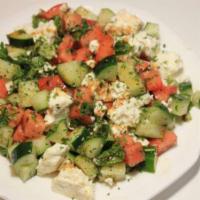 Feta Cheese Salad · Feta cheese pieces and chopped cucumbers, tomatoes, mint, parsley, olive oils and spices.
