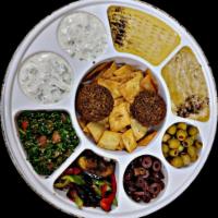 Mixed Appetizers Plate · A combination of appetizers hummus, tabbouleh, Baba Ghanoush
, eggplant salad, pita chips an...