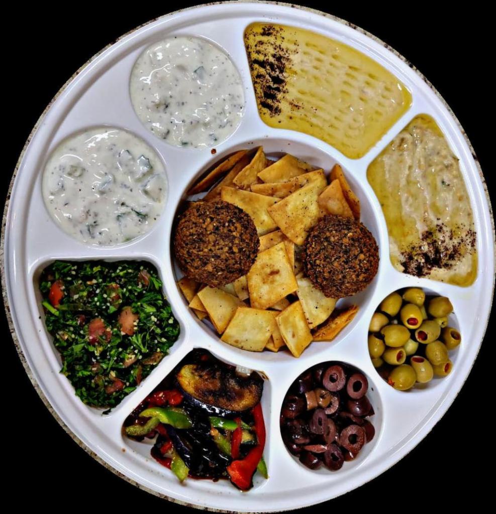 Mixed Appetizers Plate · A combination of appetizers hummus, tabbouleh, Baba Ghanoush
, eggplant salad, pita chips and olive salad. Serve up to 4 person. Vegetarian.