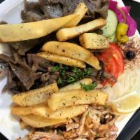 Gyro & Shawarma Combo · A Combination Of Beef & Chicken Shawarma with Gyro Lamb with A Side Of hummus, Pickles And F...