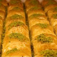 Baklava with Pistachios · A rich, sweet dessert pastry made of layers of filo filled with chopped nuts and sweetened a...
