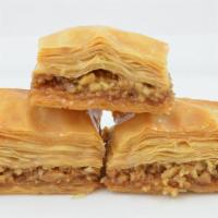 Baklava with Walnuts · A rich, sweet dessert pastry made of layers of filo filled with chopped nuts and sweetened a...