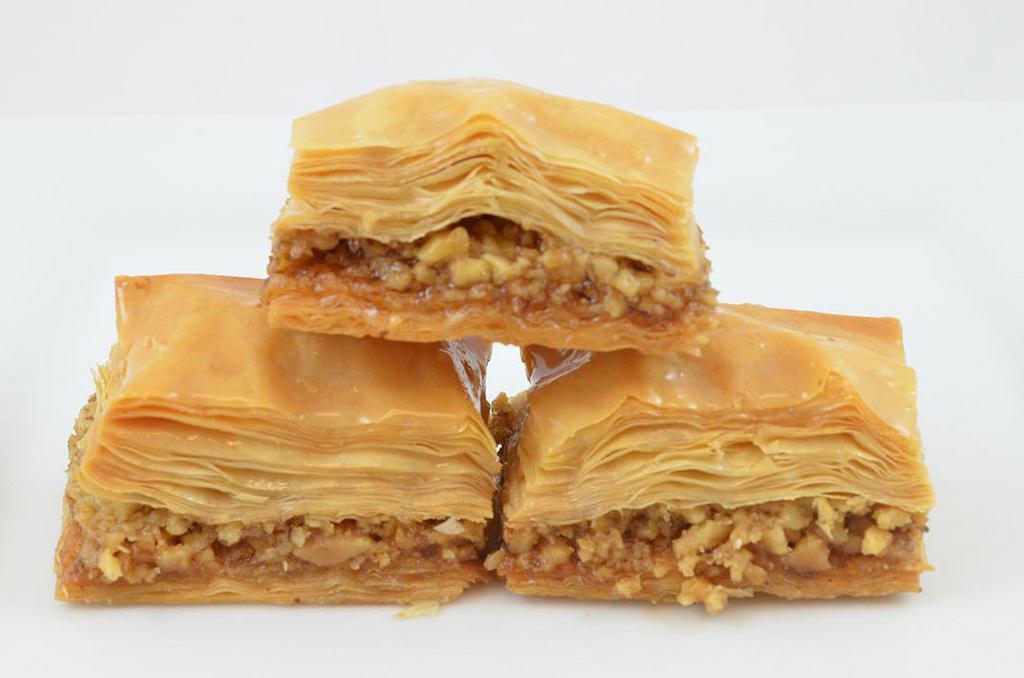 Baklava with Walnuts · A rich, sweet dessert pastry made of layers of filo filled with chopped nuts and sweetened and held together with syrup.
