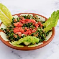 Tabbouleh Salad · Parsley with cracked wheat, tomatoes, onion, lemon juice, and oil. 