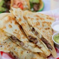 CARNE ASADA QUESADILLA · ON FLOUR TORTILLA WITH GRILLED ANGUS STEAK AND SIDES OF GUACAMOLE, SOUR CREAM, AND PICO DE G...