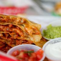 AL PASTOR QUESADILLA · ON FLOUR TORTILLA WITH ROTISSERIE MARINATED PORK AND SIDES OF GUACAMOLE, SOUR CREAM, AND PIC...