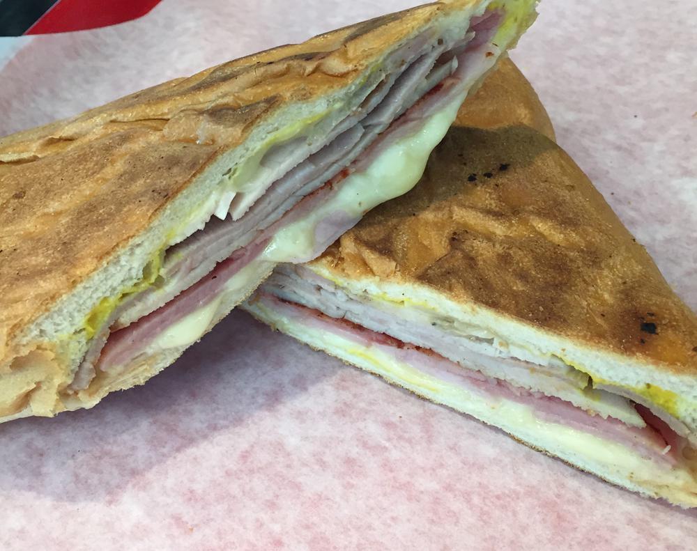 Traditional Sandwich · Ham, roasted pork, Swiss cheese, mustard and pickles.
with a Splash of Mojo