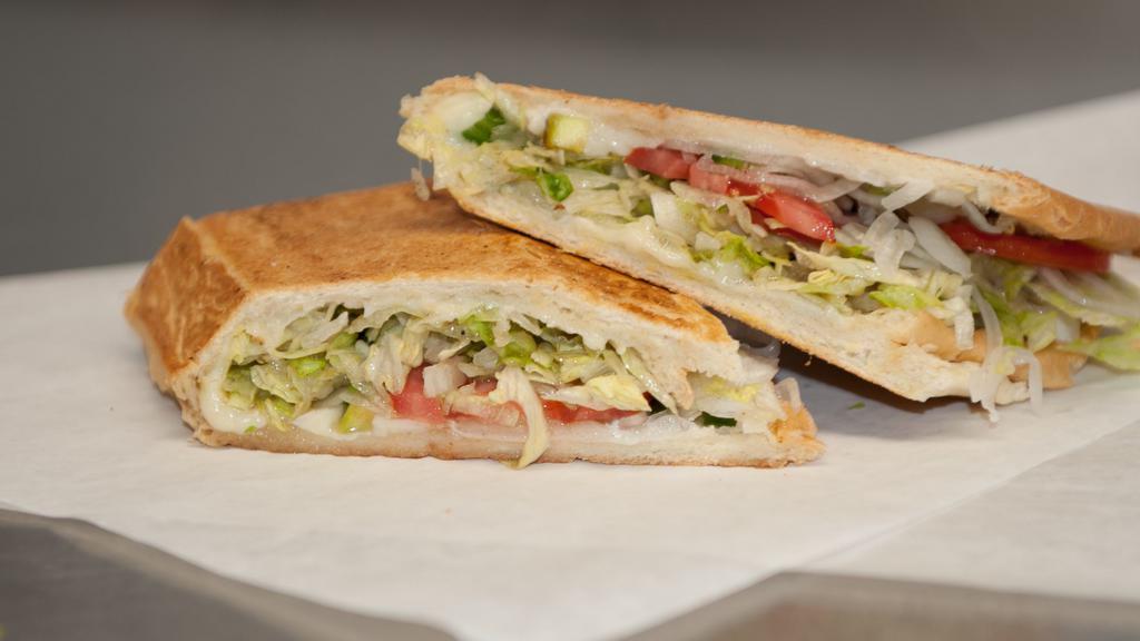 Veggie Sandwich · Swiss cheese, pickles, mayonnaise. Include lettuce, tomato, onion, jalapeno, and mojo.