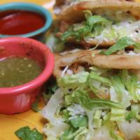 Gorditas · Two corn tortillas filled with Monterey Jack and Chihuahua cheeses, lettuce, and crema fresc...