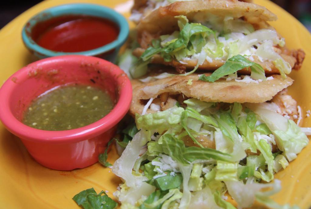 Gorditas · Two corn tortillas filled with Monterey Jack and Chihuahua cheeses, lettuce, and crema fresca. Topped with queso fresco and served with tomatillo and ranchera salsas.