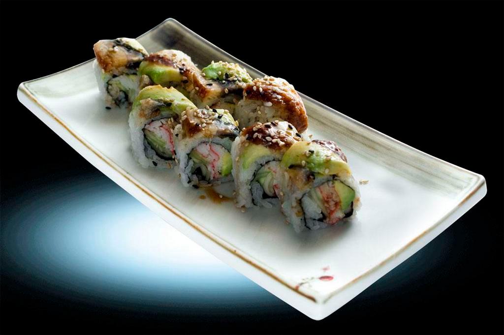 Dragon Roll · Crab stick, avocado and cucumber, top with eel, avocado and eel sauce.