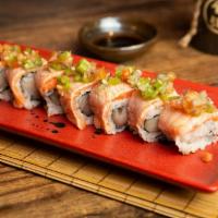 Aburi Salmon Roll · Seared salmon on yellowtail and jalapeno roll with wasabi salsa.