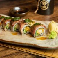 Surf & Turf Roll · Kobe beef on shrimp tempura roll, shiso, chimichurri and nikiri soy sauce.
(Dear Customer be...