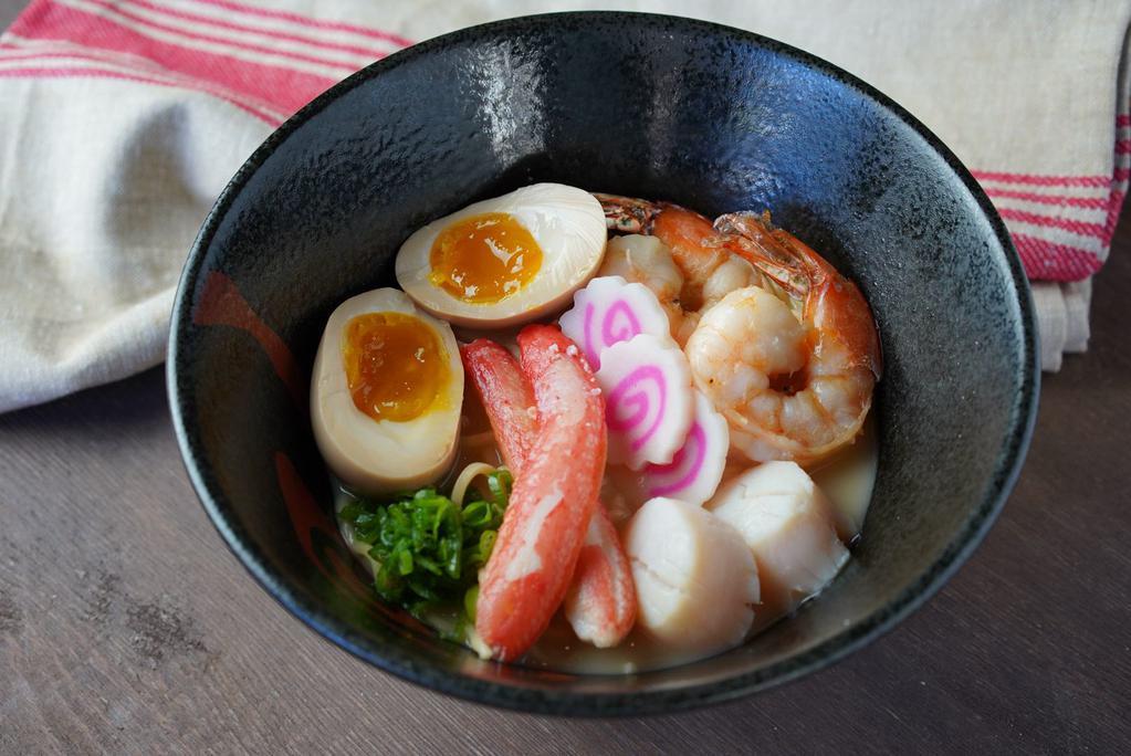 Seafood Ramen · Japanese noodles with jumbo shrimp, snow crab meat, scallop, bamboo, fish cake & scallion with soup.
