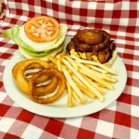 Prickly Pear BBQ Cheeseburger · Topped with our special prickly pear BBQ sauce, 2 pieces of applewood bacon, and an onion ri...
