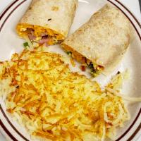 Breakfast Burrito · Ham, eggs, red and green bell peppers, onions, tomatoes, and cheddar cheese. Served with has...