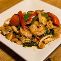 N3. Drunken Noodles · Wide rice noodles with egg, tomatoes, bell peppers, mushrooms, onions, sweet basil and chili...