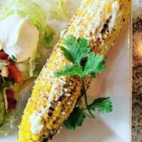 Elote · Mexican style corn on the cob with cheese, tajin and mayo