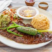Carne Asada · 10 oz. Lean skirt steak lightly seasoned and charbroiled to perfection. Served with guacamol...
