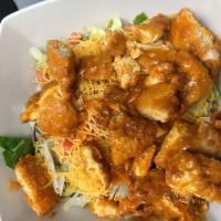 Chicken Varsity Salad · Fried or grilled chicken on a bed of mixed greens, topped with cheddar, tomato, red onion an...