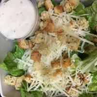 Side Caesar Salad · Chopped romaine, Parmesan cheese, croutons and Caesar dressing.