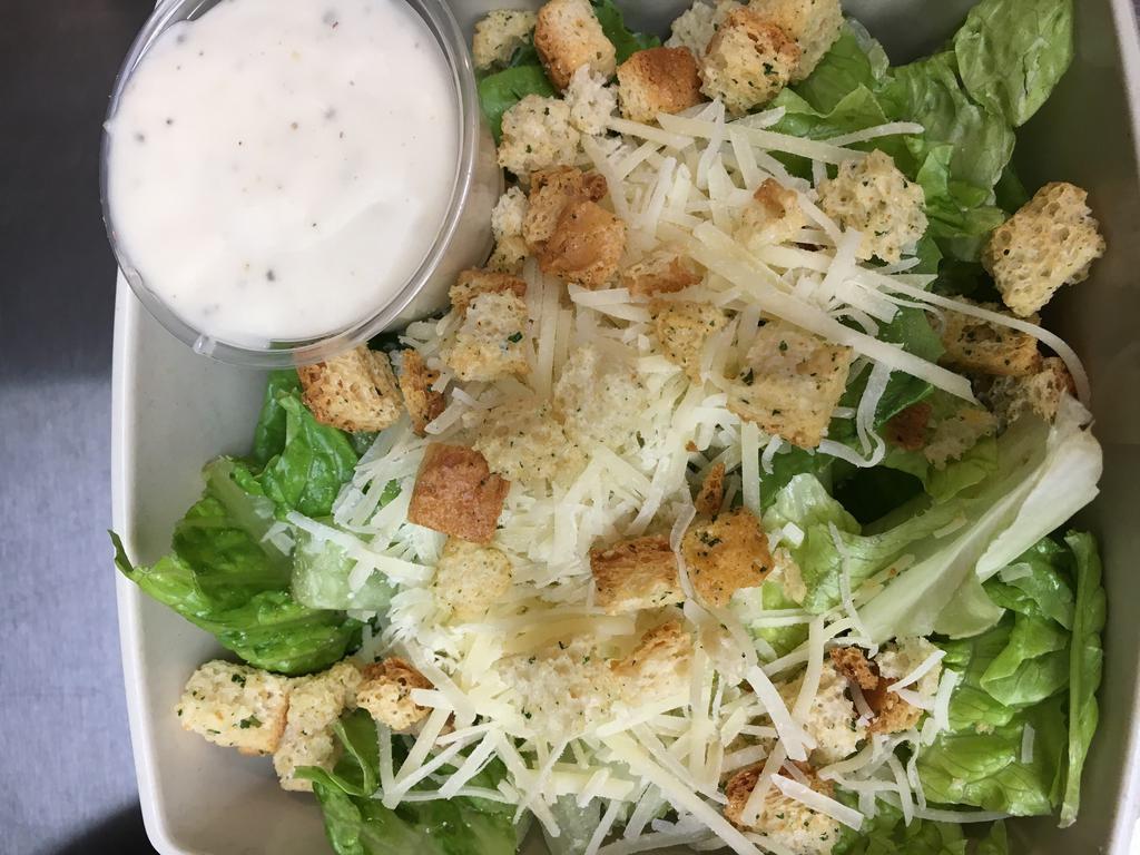 Side Caesar Salad · Chopped romaine, Parmesan cheese, croutons and Caesar dressing.
