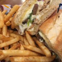 Chicken Philly Sub · Grilled chicken with peppers, mushrooms and onions smothered in white American cheese. Inclu...