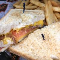 Loaded Grilled Cheese Sandwich · Melted American cheese, crispy bacon and tomato on Texas toast. Served with choice of side.