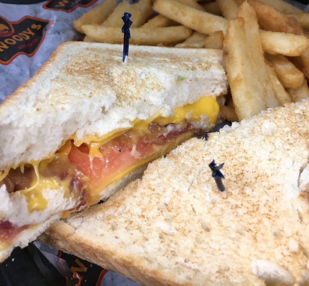 Loaded Grilled Cheese Sandwich · Melted American cheese, crispy bacon and tomato on Texas toast. Served with choice of side.