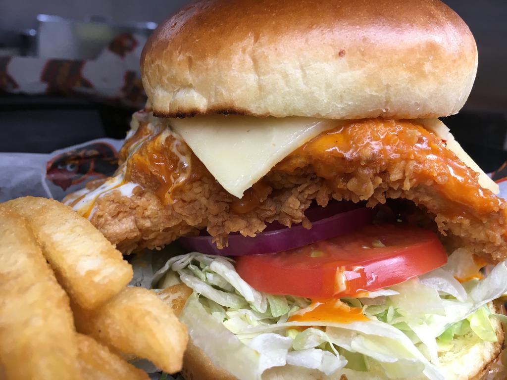 Buffalo Chicken Sandwich · Fried or grilled chicken, 2nd degree sauce, pepper jack cheese, lettuce, tomato, onion and ranch dressing. Served with choice of side.